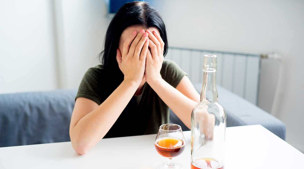 young woman battling alcohol abuse and addiction