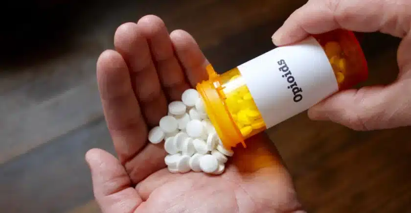 Opioid pills being poured out onto hand